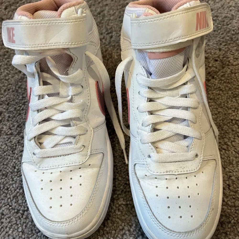 Pink and white Nike mid rises